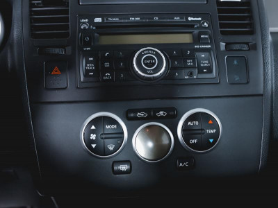 Nissan Tiida 1.6 AT (110 л. с.)